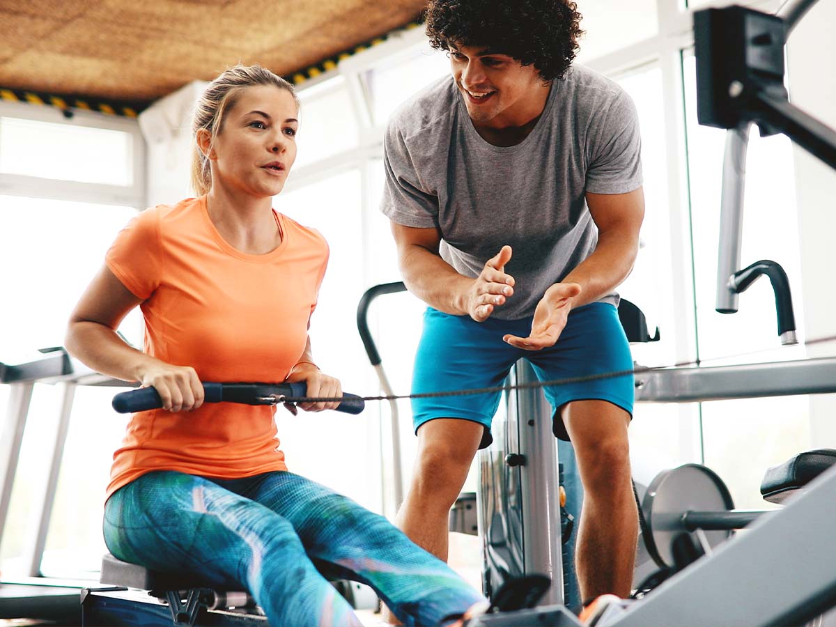 Trainer coaching a client